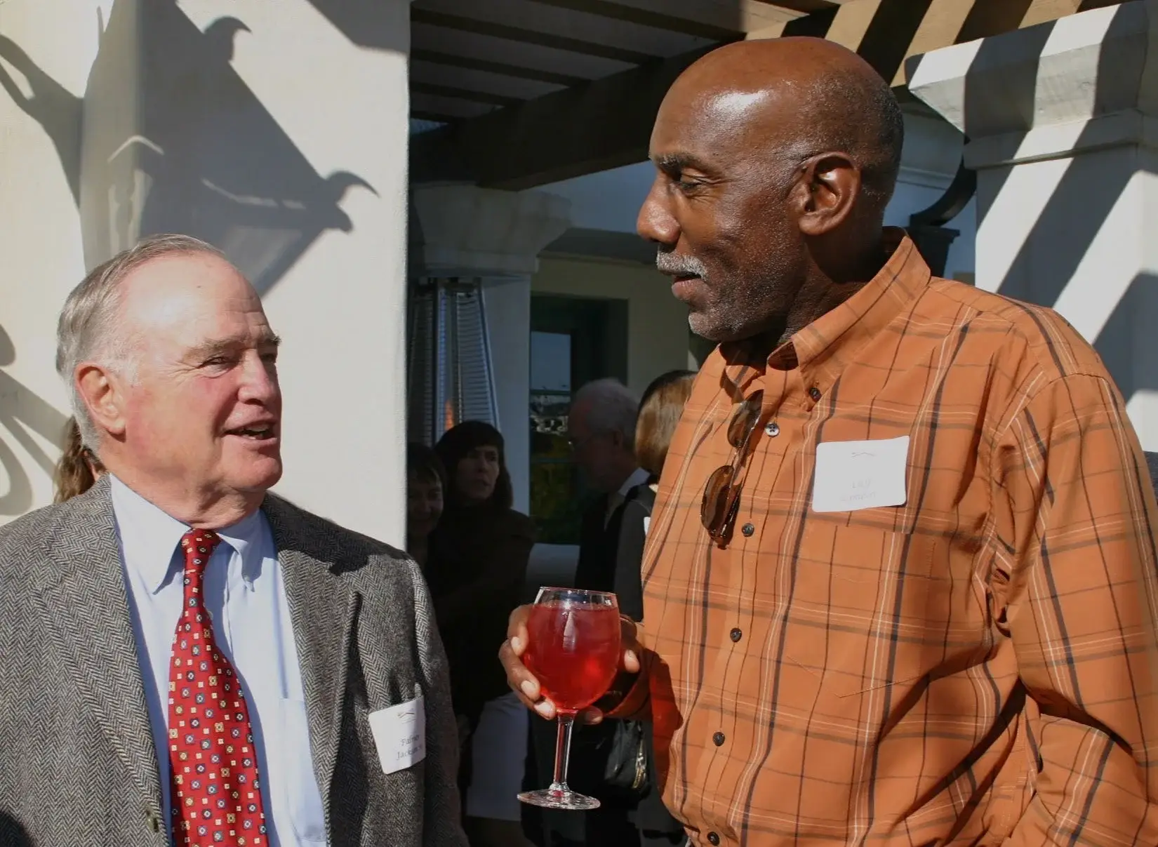 Palmer Jackson Sr. and Cliff Lambert talking at a 2011 trustee luncheon